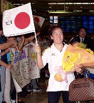 Triumphant Tamura returns home